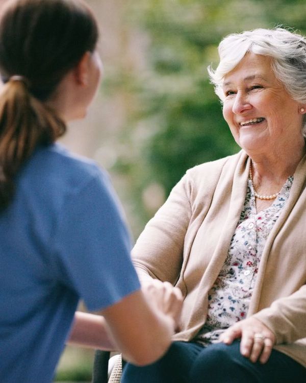 Shot of a senior woman in a wheelchair being cared for a nurse
