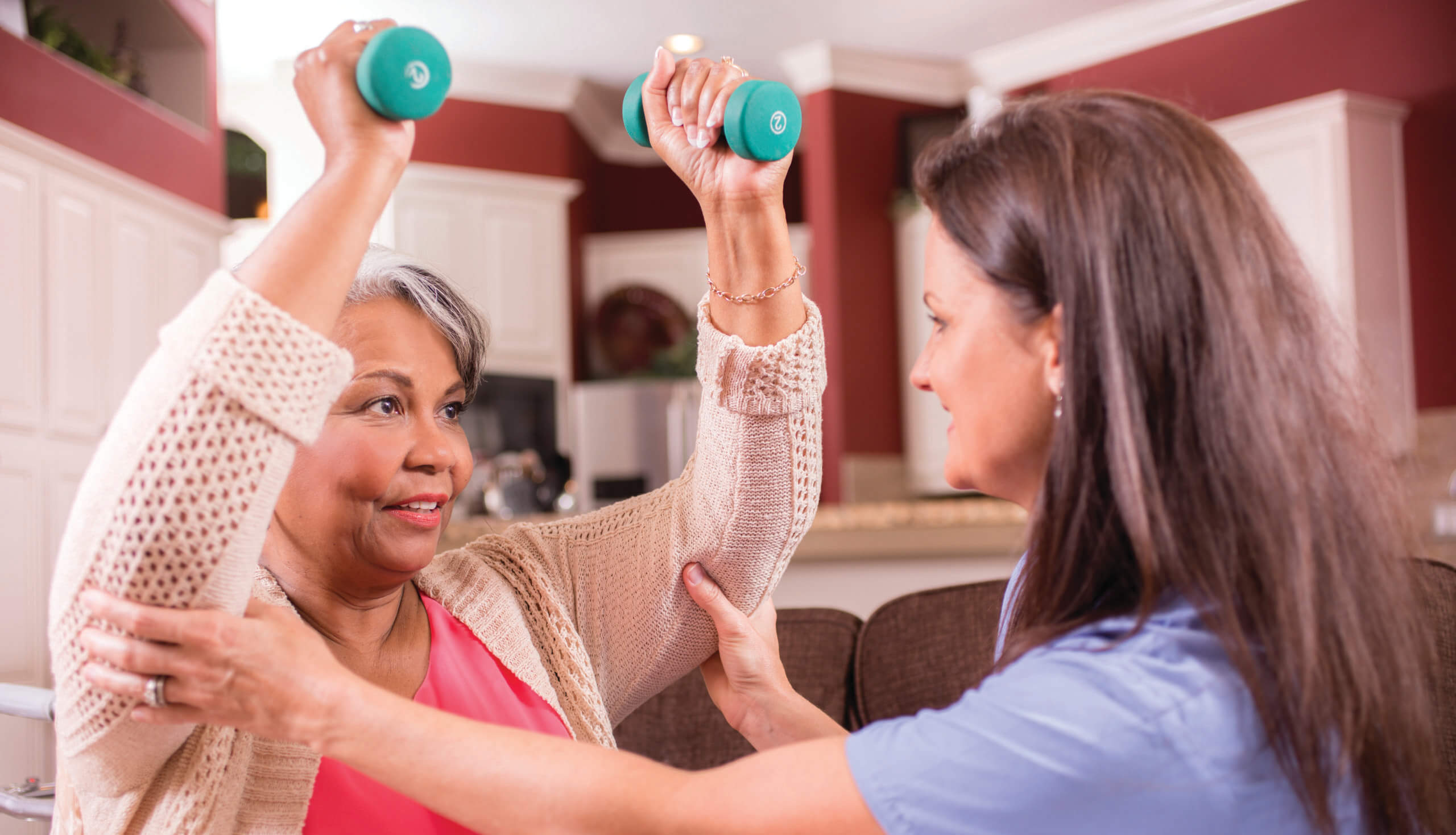 healthcare nurse conducts physical therapy exercises with senior patient