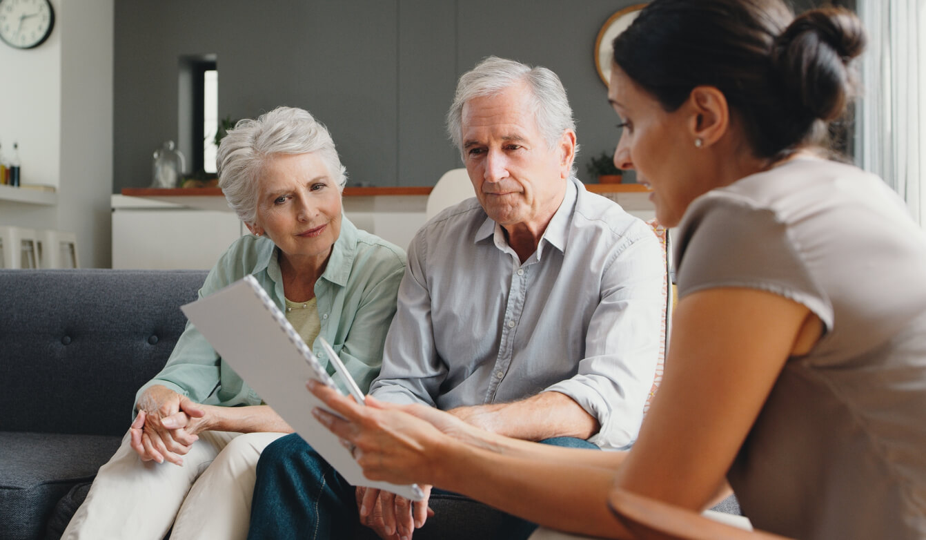 Financial advisor, and senior couple future planning in living room
